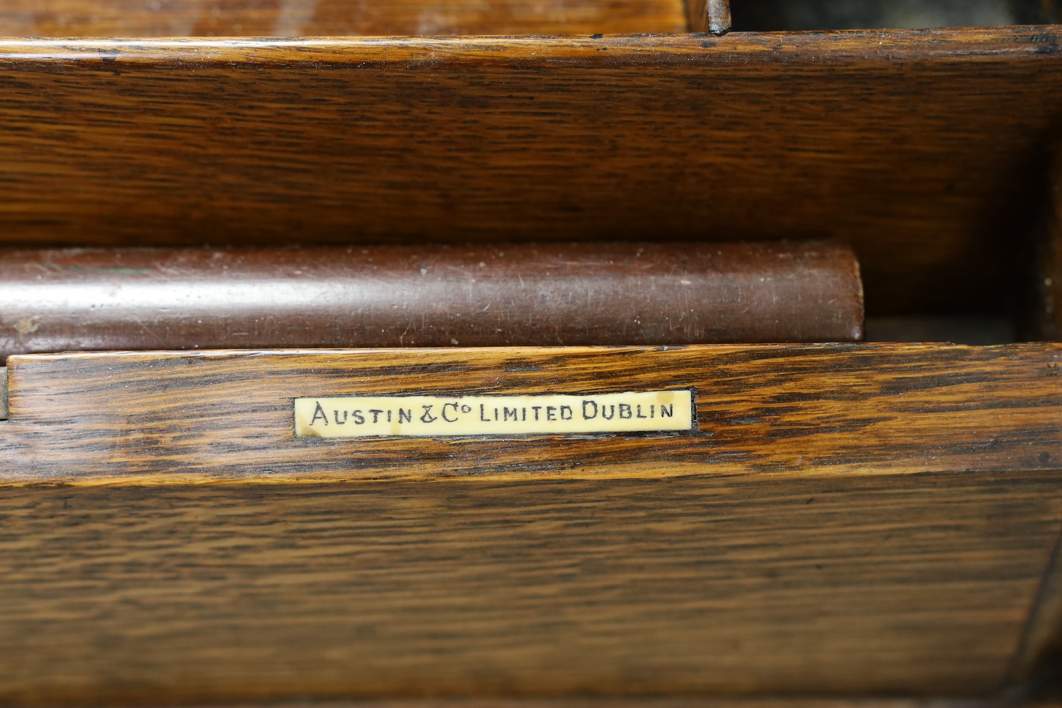 An Edwardian oak two door stationary box, 36 cms high